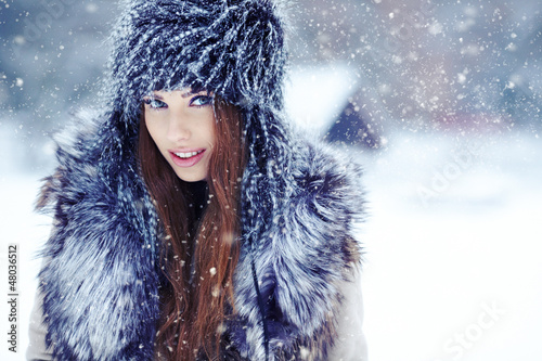Photo: a beauty girl on the winter background a beauty girl on the winter background