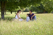 Photo: Family with happy young man, woman and child playing Family with happy young man, woman and child playing