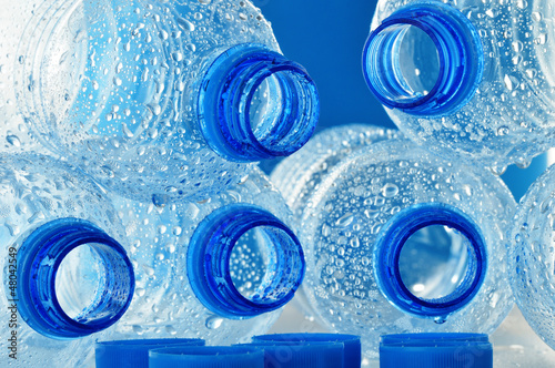 Photo: Composition with empty polycarbonate plastic bottles of mineral Composition with empty polycarbonate plastic bottles of mineral
