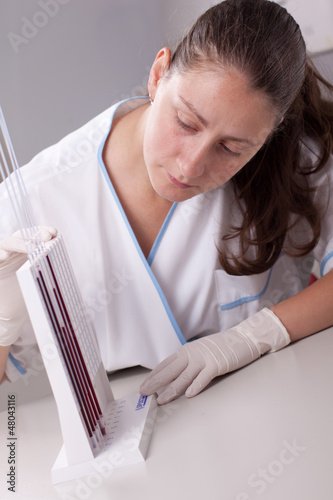 Photo: Woman doctor doing erythrocyte sedimentation rate test Woman doctor doing erythrocyte sedimentation rate test