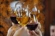 Hands holding the glasses of champagne and wine