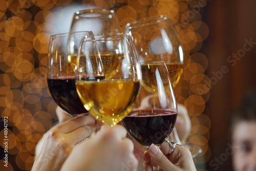 Photo: Hands holding the glasses of champagne and wine Hands holding the glasses of champagne and wine
