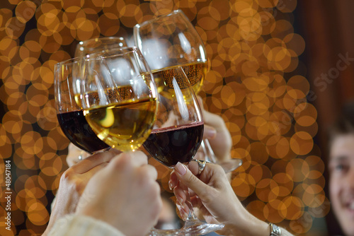 Photo: Hands holding the glasses of champagne and wine Hands holding the glasses of champagne and wine