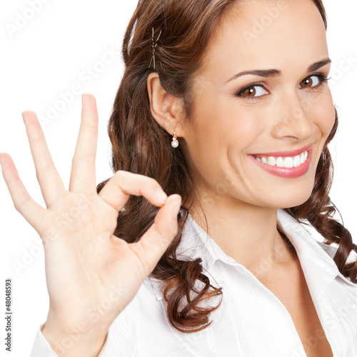 Photo: Businesswoman with okay gesture, isolated Businesswoman with okay gesture, isolated