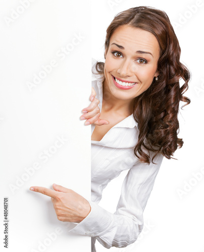 Photo: Businesswoman showing blank signboard, isolated Businesswoman showing blank signboard, isolated