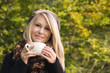 Pretty blond Girl with Cup