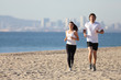 Man and woman running in the beach