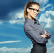 Foto: Portrait of smiling business woman, isolated on sky background Portrait of smiling business woman, isolated on sky background