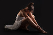 Intimate woman portrait wearing white dress 