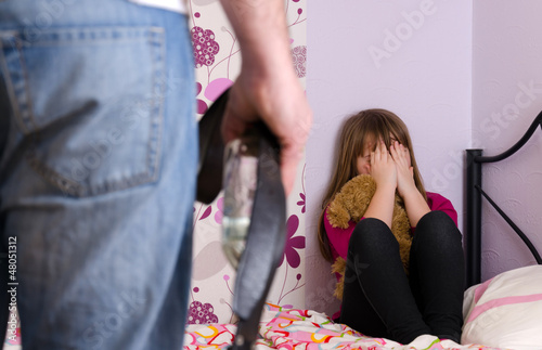 Photo: Scared daughter because of father anger after alcohol drinking Scared daughter because of father anger after alcohol drinking