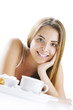 Photo: Smiling woman having breakfast Smiling woman having breakfast