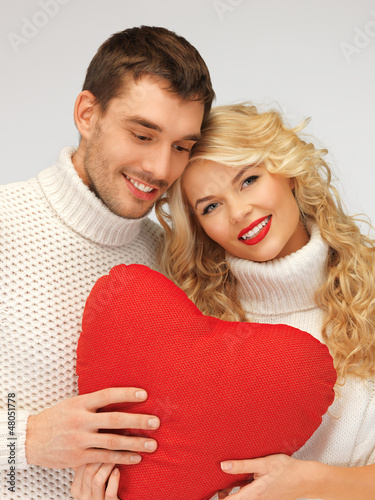 Photo: family couple in a sweaters with heart family couple in a sweaters with heart
