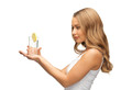woman with lemon slice on glass of water
