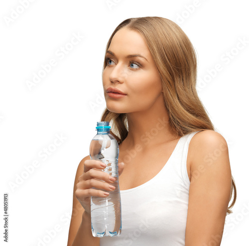 Photo: young beautiful woman with bottle of water young beautiful woman with bottle of water