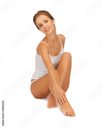 Photo: woman in cotton undrewear touching her legs woman in cotton undrewear touching her legs
