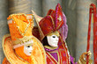 Person in Venetian costume attends the Carnival of Venice.