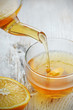 Pouring Tea into Glass Cup