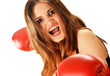 Portrait of young woman with red boxing gloves