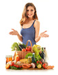 Young woman with variety of grocery products