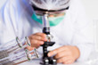 laboratory assistant working with a microscope