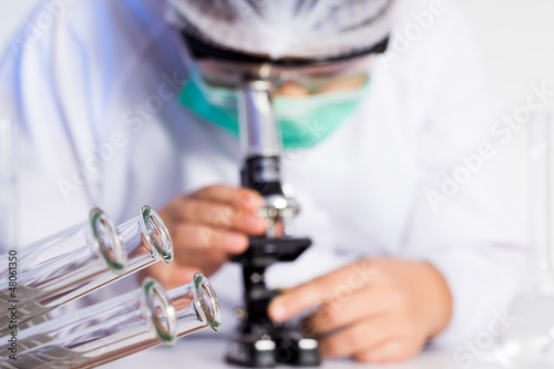 Photo: laboratory assistant working with a microscope laboratory assistant working with a microscope