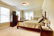 Photo: Large bright bedroom with wood furniture and beige tones. Large bright bedroom with wood furniture and beige tones.