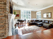 Bright luxury living room with stone fireplace