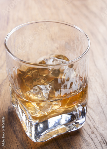 Photo: Glass of whiskey with ice Glass of whiskey with ice