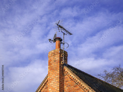 Photo: A satellite dish and TV arial A satellite dish and TV arial