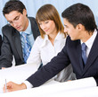 Three businesspeople working at office