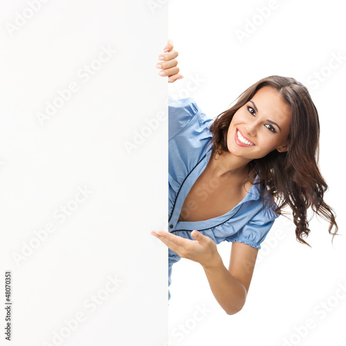 Photo: Beautiful young woman showing blank signboard Beautiful young woman showing blank signboard