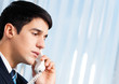 Portrait of young smiling businessman or call center worker