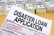 Approved disaster loan application form and dollar bills