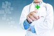 Doctor Pointing On Green Cross