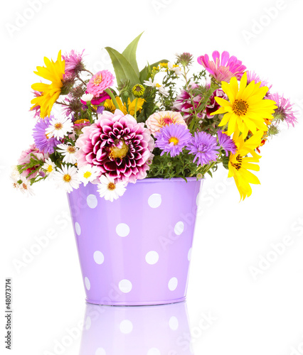 Photo: beautiful bouquet of bright flowers in metal pot isolated beautiful bouquet of bright flowers in metal pot isolated