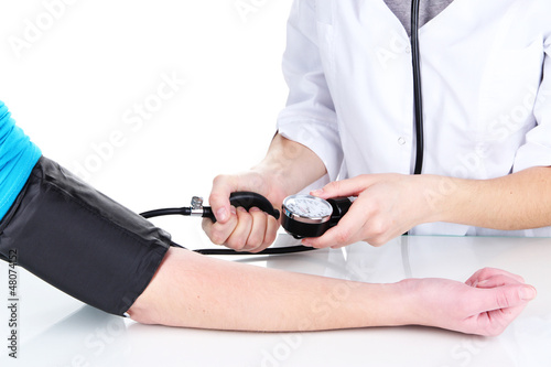 Photo: Blood pressure measuring isolated on white Blood pressure measuring isolated on white