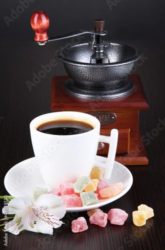 Photo: White cup of Turkish coffee with rahat delight and coffee mill White cup of Turkish coffee with rahat delight and coffee mill
