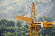 Building crane with hills on background