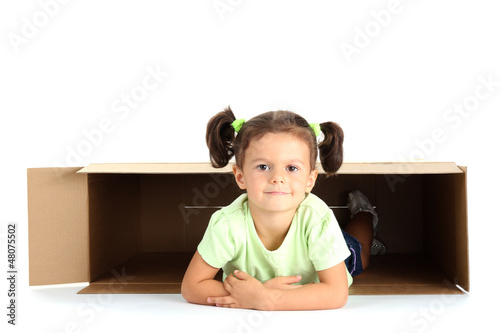 Photo: beautiful little girl with box isolated on white beautiful little girl with box isolated on white