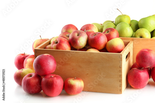Photo: juicy apples in wooden crates, isolated on white juicy apples in wooden crates, isolated on white