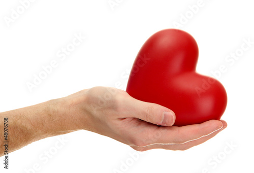 Photo: Red heart in man hand, isolated on white Red heart in man hand, isolated on white