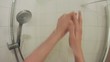 Adult man takes a shower first person HD