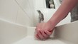 Young adult washing hands after toilet
