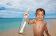 Photo: kid found sos bottle in the sea kid found sos bottle in the sea