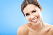Portrait of beautiful woman, on blue