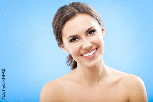 Photo: Portrait of beautiful woman, on blue Portrait of beautiful woman, on blue