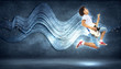 Photo: young man playing on electro guitar and jumping young man playing on electro guitar and jumping
