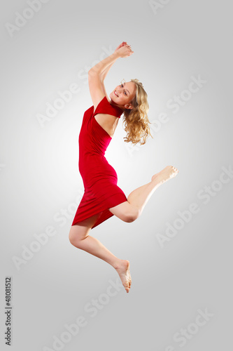 Photo: Young female dancer jumping Young female dancer jumping