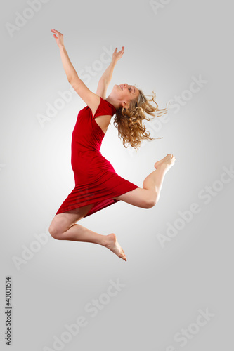 Photo: Young female dancer jumping Young female dancer jumping