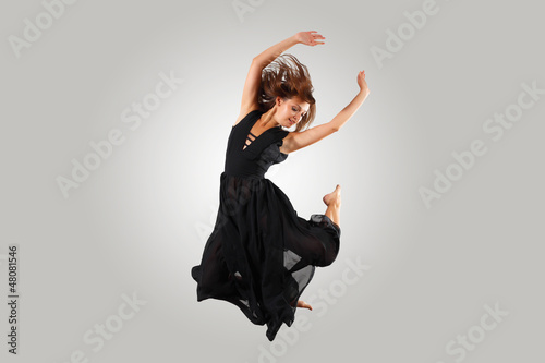 Photo: Young female dancer jumping Young female dancer jumping